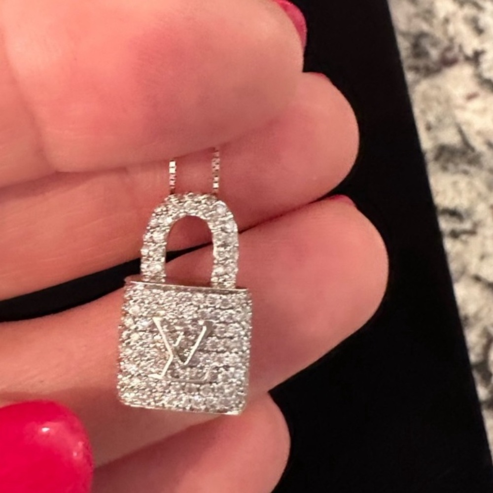 14 K white gold pendant with diamonds.